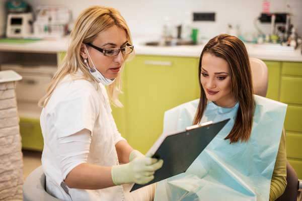 Dentist Talking with Patient